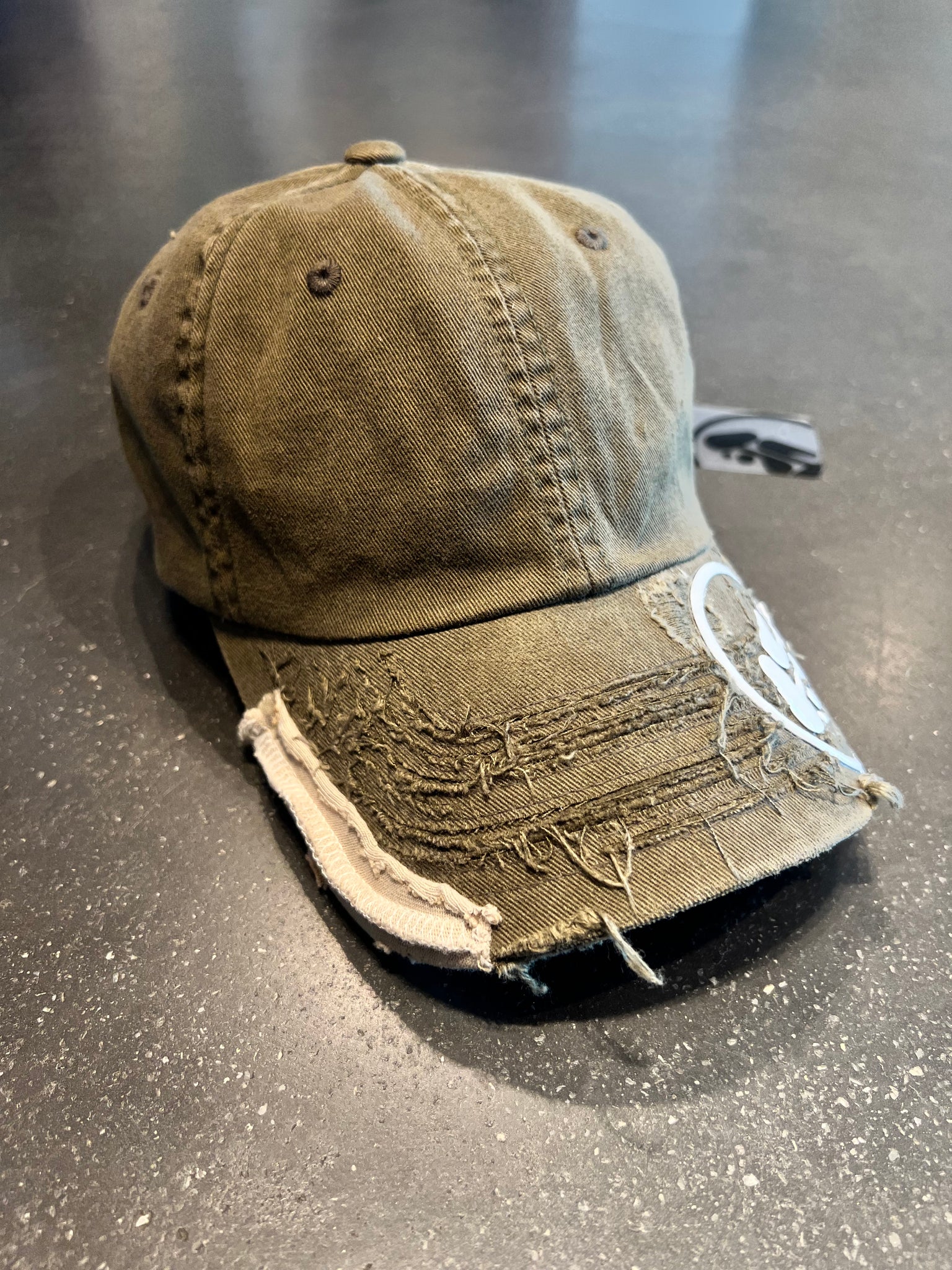 Destroyed logo cap